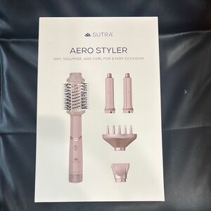 Pink Hair Styling Tool with Versatile Attachments